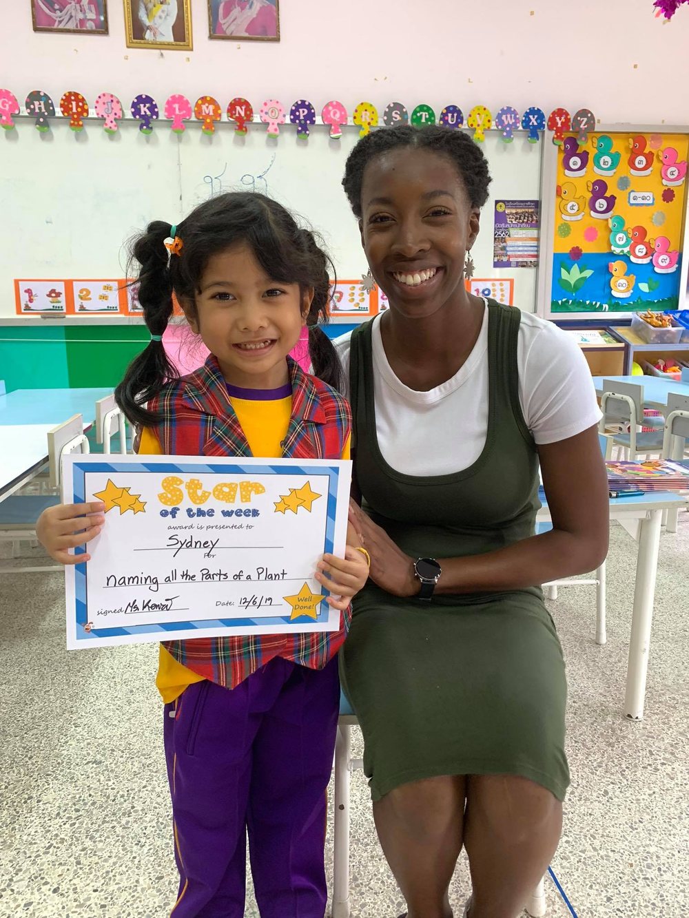 Student with teacher after an achievement activity